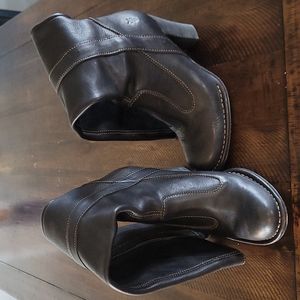 Frye knee high heeled boots.